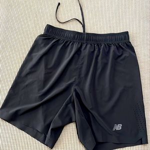 New Balance Men's training lightweight shorts with one zip pocket